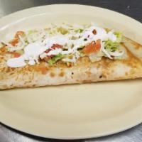 Quesadilla Dinner · Flour tortilla stuffed with cheese, choice of meat, topped with lettuce tomatoes, and sour c...