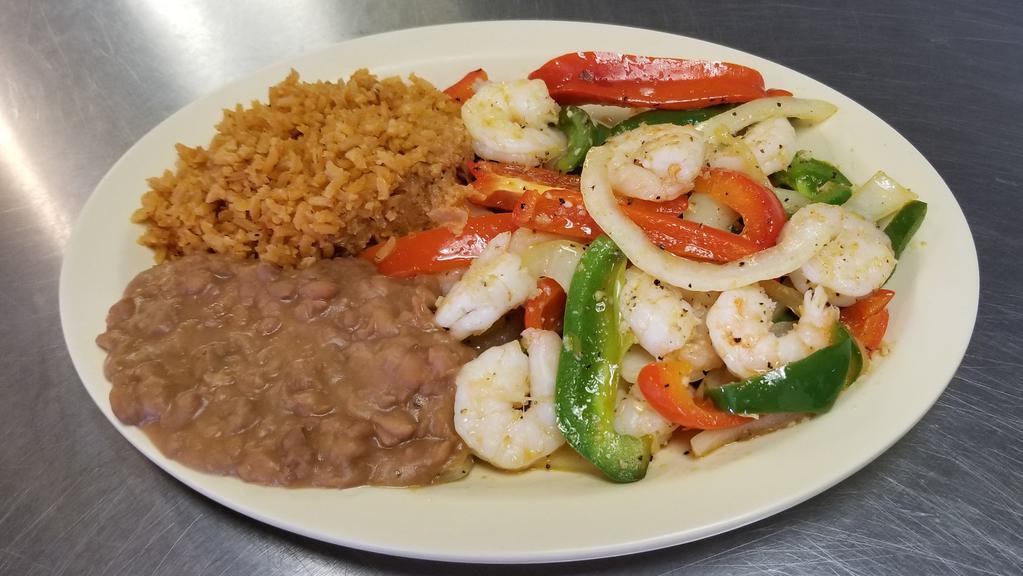 Shrimp Fajitas · Grilled shrimp sautéed with red and green peppers, onions and tomato served with rice and beans. With a choice of flour or corn tortillas.