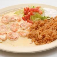 Shrimp & Cream · Shrimp in our special cream sauce served with rice, tomatoes lettuce, and sour cream. With a...