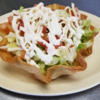 Taco Salad · Crispy tortilla shell filled with ground beef or chicken beans, lettuce cheese, tomatoes, an...