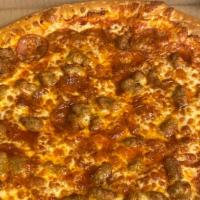 Meat Lovers Pizza · Pepperoni, ham, ground beef, bacon, provolone & mozzarella cheese.