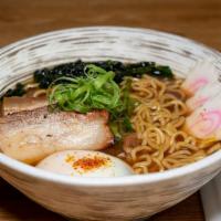 Pork Belly · Slow roasted pork shoulder with poached egg, fish cake, and wakame in pork broth. Spicy brot...