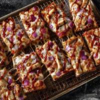 Bbq Chicken Pizza · Mozzarella cheese, grilled chicken, bacon, red onions, and Sweet Baby Rays BBQ sauce.