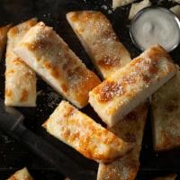 Jet'S Original Bread · Baked bread with mozzarella cheese. Topped with butter, garlic, and Romano cheese. Includes ...