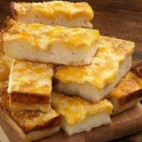 Jet'S Deep Dish Bread · Twelve pieces of baked crunchy corner deep dish bread with mozzarella cheese. Topped with bu...