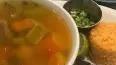 Caldo De Res · Homemade beef soup with rice, cilantro and onion on the side, and your choice of corn or flo...