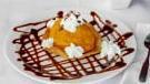 Fried Ice Cream · Vanilla ice cream coated with cornflake crumbs, spiced with cinnamon sugar, then quickly fri...