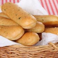 Breadsticks · Crispy and buttery baked breadsticks.