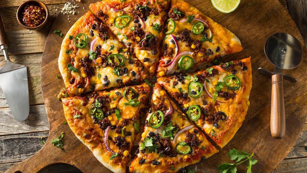 Taco Special Pizza · Fresh out of the Oven, Cheese Pizza topped with Beef, onions, and olives. Once the pizza is cooked, is is then topped with lettuce and tomatoes.