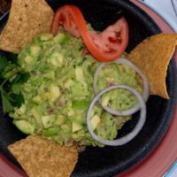 Guacamole & Chips · Our avocado dip made from ripe avocados, diced tomatoes, chopped cilantro, and sweet onions....