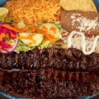 Carne Asada O Pollo Zamora · Your choice of a tender skirt steak or a grilled chicken breast topped with our original 
