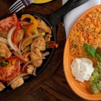 Fajitas De Bistec O Pollo · Generous portions of skirt steak or tender chicken breast, grilled with slices of onions, to...