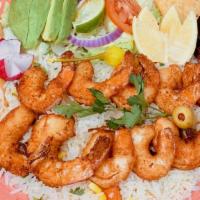Camarones Empanizados · Butterflied shrimp breaded with our own spices, served with white rice and salad. Accompanie...
