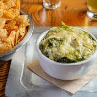 Spinach Artichoke Dip · (VT, GF) Spinach, artichoke, roasted garlic, and parmesan dip. Comes with fresh fried corn t...