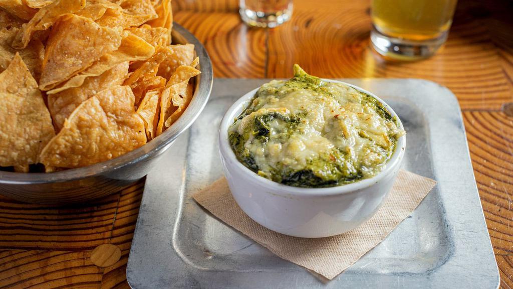 Spinach Artichoke Dip · (VT, GF) Spinach, artichoke, roasted garlic, and parmesan dip. Comes with fresh fried corn tortilla chips.