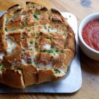 Cheesy Crack Bread · (VT) House blend of cheeses on fresh baked cracked bread, smothered in garlic herb butter, a...