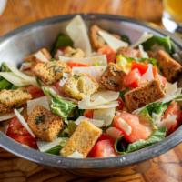Caesar Salad · Romaine lettuce, roma tomato, herbed croutons, and shaved parmesan with house caesar dressing.
