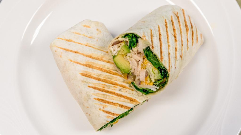 Spicy Avocado Chicken Wrap · Spicy. Grilled chicken breast, grilled onions, spicy mayo, avocado, lettuce, shredded Colby Jack cheese and grilled in a flour tortilla.