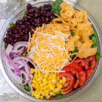 Southwest Salad · Shredded cheese, corn, tomato, onions, black beans, tortilla corn chips.