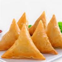 Vegetable Samosas
 · Vegetable in a flaky pastry served with a crispy salad.