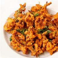 Onion Bhaji
 · Spiced shredded onions marinated with flours & deep fried.