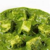 Palak Paneer · Cooked with spinach, homemade cheese, and spices.