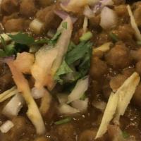 Chana Masala · Chickpeas cooked with tomatoes, onions, ginger, and in a exotic of Indian spices.
