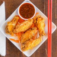 Golden Wings · Deep fried chicken wings. Ask for our Thai spicy sauce if available.