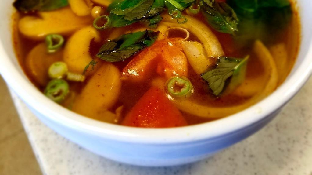 Tom Yum Soup (Thai Hot & Sour Soup) · Choice of meats or seafood simmered in hot and sour broth with lemongrass, onions and mushroom. Topped with fresh cilantro.