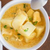 Yellow Curry · Potatoes simmered in coconut milk and topped with fresh onions.