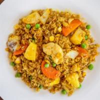 Pineapple Fried Rice · Fried rice bursting with exotic flavors with sweet pineapples chunks and mixed with vegetabl...