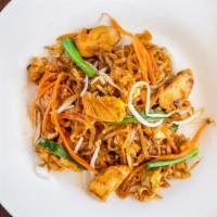 Pad Thai-Thin · Thin rice noodles sautéed with tofu, egg, onions, topped with fresh bean sprouts. Served wit...