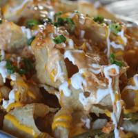 Nacho Average Chick · Wonton chips, cheese, red & green onions, pickled jalapenos, spicy ranch, sour cream w/ chic...