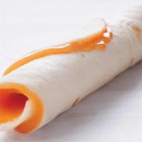  Cheese Roll Up · A warm fluffy Flour Tortilla filled with nacho cheese, rolled up.