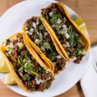 Street Taco · Choice of meat, corn tortilla, cilantro, and onion.