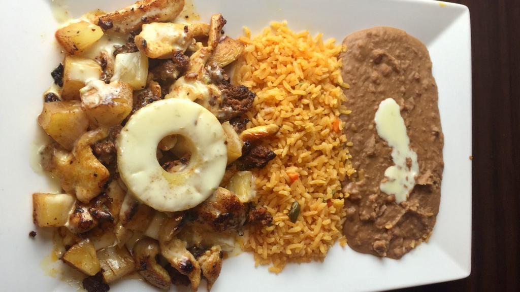 Chorizo Pollo · Chicken strips mix with chorizo (Mexican sausage), pineapple, topped with melted cheese and served with rice and beans.