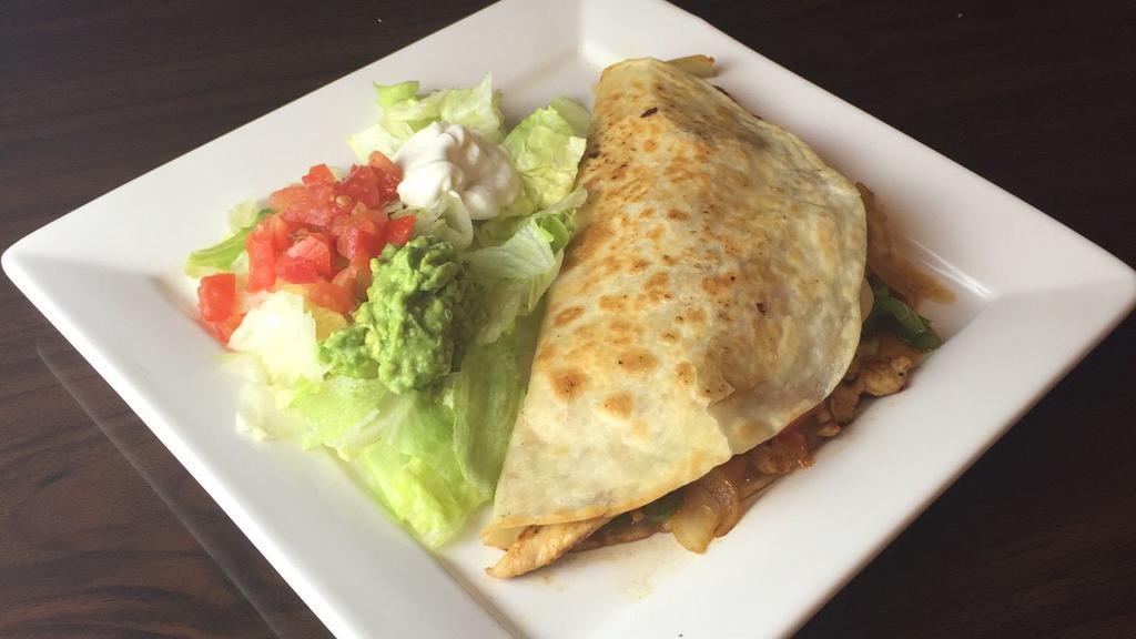 Shrimp Or Lobster Quesadilla Rellena · A flour tortilla grilled and stuffed with your choice of shrimp or lobster, rice, cheese, grilled onions, bell peppers, and tomatoes. Served with lettuce, guacamole, and sour cream.