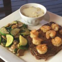 Chef Special · Grilled steak and shrimp cooked with mushrooms, zucchini, and poblano peppers, served with m...