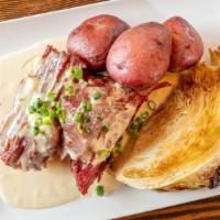 Corned Beef & Cabbage ** · Roasted corned beef, cabbage, boiled potatoes,and white sauce.