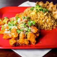 Sesame Chicken · Breaded chicken tossed in a sweet and spicy sesame sauce and topped with toasted sesame seed...