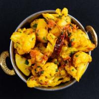 Aloo Gobhi · Fresh cauliflower & potatoes cooked to perfection in North Indian spices with tomatoes, ging...