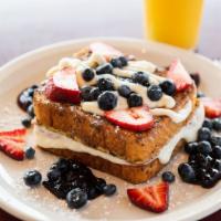 Stuffed French Toast · French toast with cream cheese icing, blueberry compote,fresh strawberries and blueberries, ...