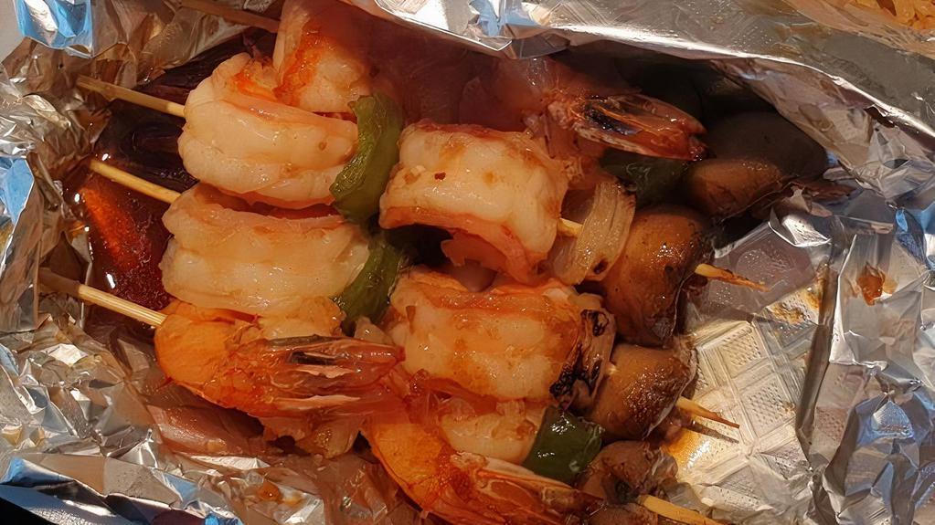 Shrimp Kabob · Four sticks. Grilled onions, mushroom, and green pepper with hibachi fried rice on the side.