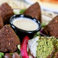 Falafel Plate · Six pieces. Chickpeas and fava beans ground with vegetables and spices. Served with tahini s...