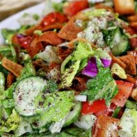 Fattoush Salad · Traditional salad mixed with pita chips.