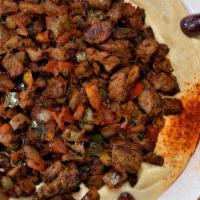 Hummus With Meat · Halal. Chickpeas blended with tahini sauce, garlic and lemon. Topped with ground beef.