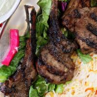 Lamb Chops · Halal. Tender marinated and char broiled. Comes with two sides.