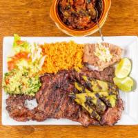 El Pistolero Steak Dinner · The gunslinger plate fuels your mission with a hearty care asada (steak] so good, fingers wi...
