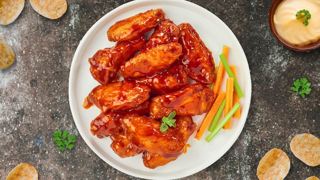 Buffalo Chicken Wings · Fresh chicken wings breaded, fried until golden brown, and tossed in buffalo sauce. Served with a side of ranch or bleu cheese.
