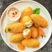 Jalapeno Poppers · Fried jalapeños filled with gooey melty cheese, served with ranch. 6 piece.